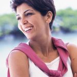 Smiling woman with bright teeth in an outdoor portrait