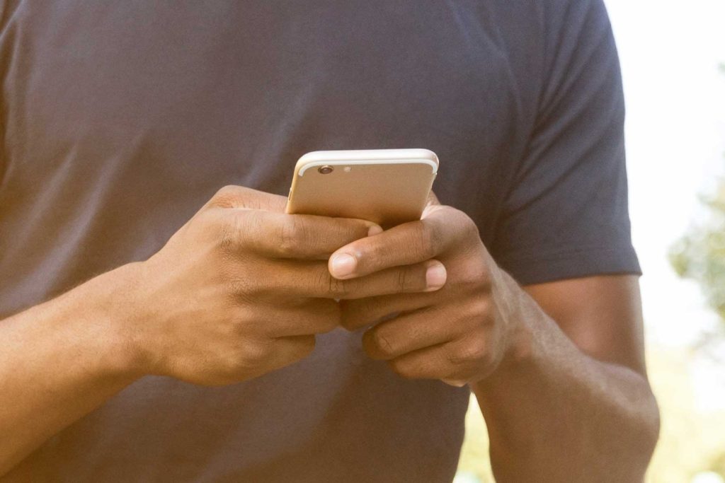 Close-up of a person holding and using a smartphone