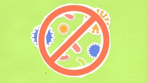 Paper cutout stop symbol over stylized microbes on a green background