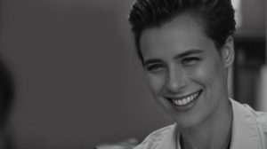 Smiling man showing teeth in a close-up portrait