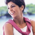 Smiling woman with bright teeth in an outdoor portrait