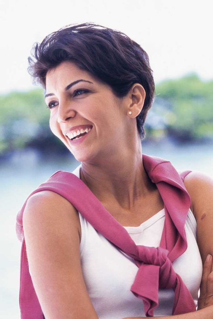 Smiling woman with bright teeth in an outdoor portrait