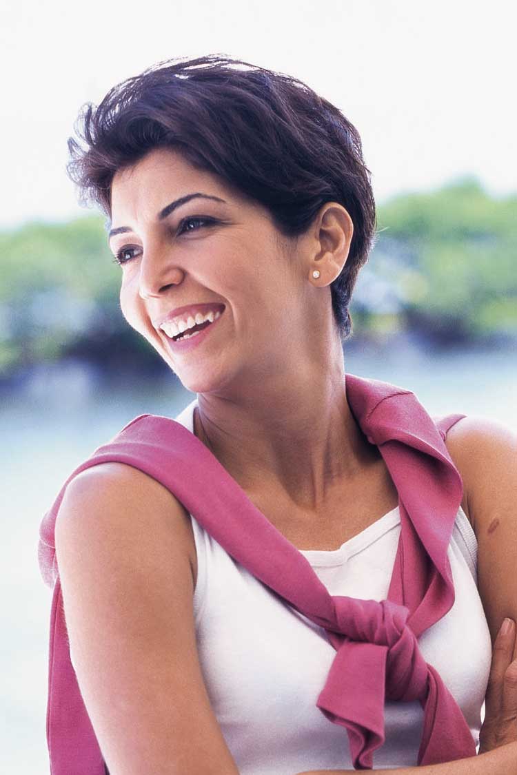 Smiling woman with bright teeth in an outdoor portrait